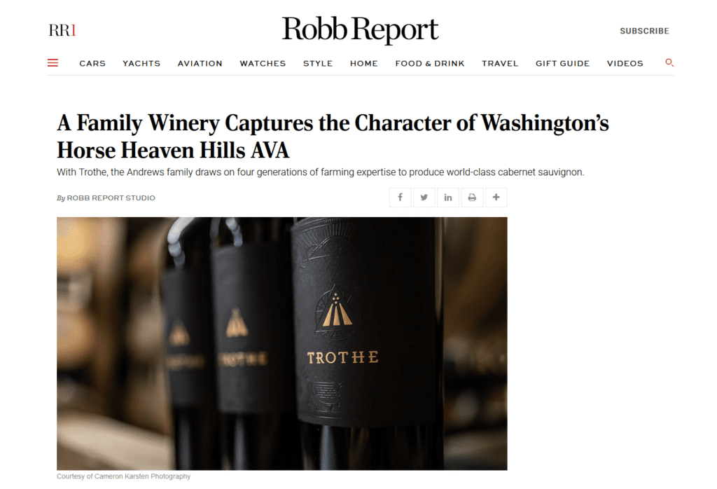 Image of Robb Report article header - A Family Winery Captures the Character of Washington's Horse Heaven Hills AVA along with a bottle shot of Trothe